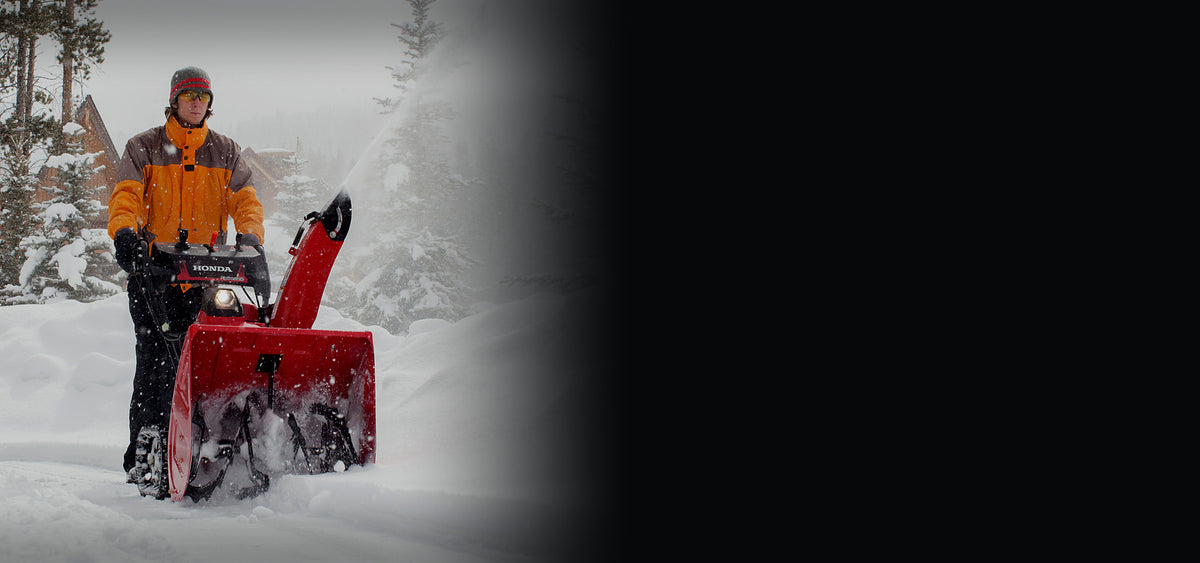 Honda HSS two-stage snow blower clearing deep snow