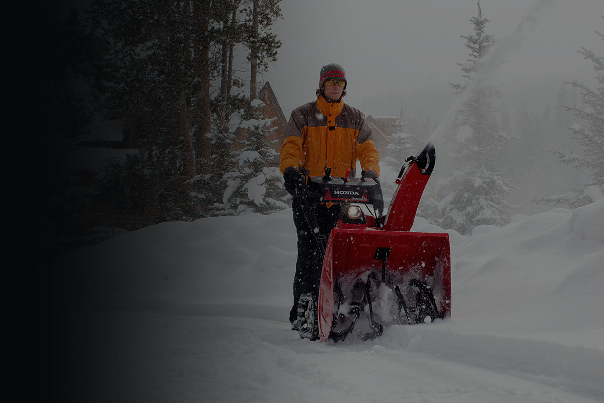 Honda HSS two-stage snow blower clearing deep snow